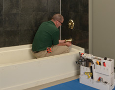 technician removing faucet system